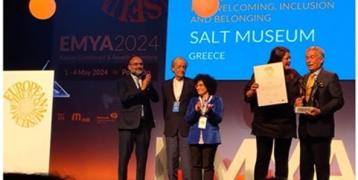 People on stage winning award